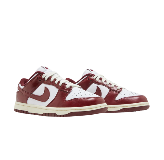 Women’s Nike Dunk Low Premium "Vintage Red" sneakers.