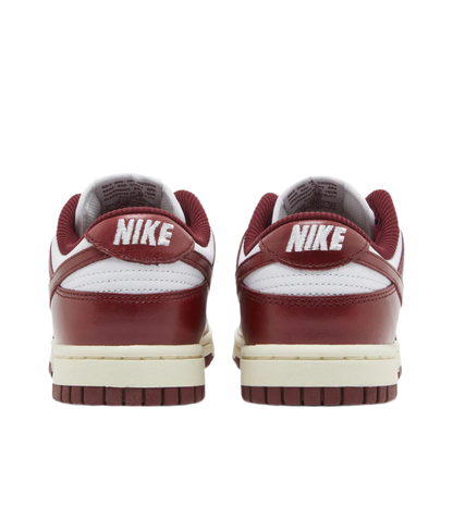Women’s Nike Dunk Low Premium "Vintage Red" sneakers.